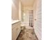 Bathroom with a tiled floor, vanity, toilet, and shower-tub combo at 1125 Campbell Pine Trl, Lawrenceville, GA 30045