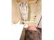 Bathroom featuring a white vanity, toilet, and shower with tiled floor at 1125 Campbell Pine Trl, Lawrenceville, GA 30045