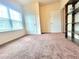 Bedroom with carpet floor, natural light, and two interior doors at 1125 Campbell Pine Trl, Lawrenceville, GA 30045