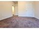 Neutral bedroom with ample space, neutral carpeting, and white doors at 1125 Campbell Pine Trl, Lawrenceville, GA 30045