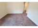 Neutral carpeted room with plain walls and minimal decoration, showing a blank canvas at 1125 Campbell Pine Trl, Lawrenceville, GA 30045