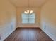 Inviting dining room featuring laminate flooring and traditional chair rail at 1125 Campbell Pine Trl, Lawrenceville, GA 30045