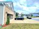 Paved driveway with a car in front of a brick and vinyl house at 1125 Campbell Pine Trl, Lawrenceville, GA 30045