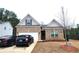 Charming brick home with a two-car garage and well-maintained front lawn at 1125 Campbell Pine Trl, Lawrenceville, GA 30045