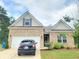 Charming brick home featuring a two-car garage, well-kept lawn, and inviting curb appeal at 1125 Campbell Pine Trl, Lawrenceville, GA 30045