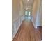 Long hallway with wood floors and white trim at 1125 Campbell Pine Trl, Lawrenceville, GA 30045