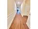 Hallway featuring wood floors and white trim at 1125 Campbell Pine Trl, Lawrenceville, GA 30045