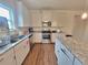 Modern kitchen featuring stainless steel appliances, granite countertops, and ample cabinet space at 1125 Campbell Pine Trl, Lawrenceville, GA 30045