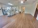 Open-concept living space with hardwood floors that connects to the kitchen and staircase at 1125 Campbell Pine Trl, Lawrenceville, GA 30045