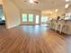 Spacious living room area with hardwood floors, natural light, and an open floor plan at 1125 Campbell Pine Trl, Lawrenceville, GA 30045