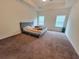 Spacious main bedroom with carpet and natural light at 1125 Campbell Pine Trl, Lawrenceville, GA 30045