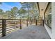 Open balcony featuring wooden railing and enough space for entertaining or relaxing at 1842 Calloway Nw Dr, Atlanta, GA 30314