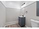 Small, functional bathroom features a modern vanity, oval mirror, and toilet, creating a tidy space at 2014 Poplar Rdg, Lawrenceville, GA 30044