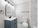 A recently remodeled bathroom features bright lighting, a new vanity, and an updated shower at 2014 Poplar Rdg, Lawrenceville, GA 30044