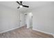 A light-filled bedroom has a modern ceiling fan, closet, and neutral walls at 2014 Poplar Rdg, Lawrenceville, GA 30044