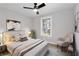 Stylized bedroom with a ceiling fan, neutral walls, and ample natural light at 2014 Poplar Rdg, Lawrenceville, GA 30044
