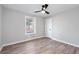 Well-lit bedroom boasts neutral paint and modern ceiling fan at 2014 Poplar Rdg, Lawrenceville, GA 30044