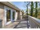 A covered outdoor deck with white trim and gray floors is accessible through French doors at 2014 Poplar Rdg, Lawrenceville, GA 30044