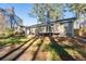 Backyard view showing a well-maintained exterior, deck, patio and lawn at 2014 Poplar Rdg, Lawrenceville, GA 30044