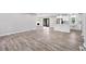 Open-concept living room showcases hardwood flooring leading to the kitchen with a breakfast bar at 2014 Poplar Rdg, Lawrenceville, GA 30044