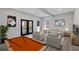 Inviting living room featuring comfortable seating, a pool table, and stylish decor for entertaining at 2014 Poplar Rdg, Lawrenceville, GA 30044