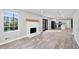 A bright living area connects to an eat-in kitchen with stainless steel appliances and white cabinetry at 2014 Poplar Rdg, Lawrenceville, GA 30044