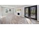Sunlit living area features hardwood floors and access to an outdoor space through glass doors at 2014 Poplar Rdg, Lawrenceville, GA 30044
