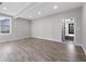 Spacious, light-filled living room with wood-look floors and neutral walls, ready for personalization at 2014 Poplar Rdg, Lawrenceville, GA 30044