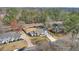 Aerial view shows the location of the home situated on a tree lined street with well manicured lawns at 3285 Mitsy Forest Ne Way, Marietta, GA 30068
