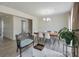 Open dining area with a modern chandelier, wood table, and new floors at 3285 Mitsy Forest Ne Way, Marietta, GA 30068