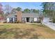 Charming single-story home with a well-maintained lawn and mature landscaping at 3285 Mitsy Forest Ne Way, Marietta, GA 30068