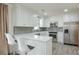 Updated kitchen features white cabinets, new appliances, and lots of countertop space at 3285 Mitsy Forest Ne Way, Marietta, GA 30068