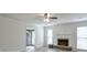 Bright living room featuring a fireplace, neutral paint, and a doorway to the entrance of the home at 3285 Mitsy Forest Ne Way, Marietta, GA 30068