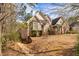 Beautiful brick home with mature trees and inviting curb appeal, offering a serene and private setting at 418 Abbey Springs Way, Mcdonough, GA 30253