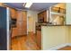 Kitchen with wood cabinets, a breakfast bar, stainless steel appliances and a view to the second floor at 418 Abbey Springs Way, Mcdonough, GA 30253