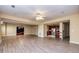 Open concept living room view to kitchen with laminate floors and recessed lights at 418 Abbey Springs Way, Mcdonough, GA 30253