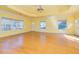 Large living room boasts hardwood floors, abundant light from many windows and access to the exterior at 418 Abbey Springs Way, Mcdonough, GA 30253