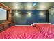 Movie room with a raised platform and a large screen at 418 Abbey Springs Way, Mcdonough, GA 30253