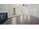 Spacious living room with a fireplace, neutral walls, and plenty of natural light at 4628 Rolling Brook Ct, Union City, GA 30291