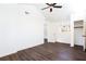 A spacious bedroom with a walk-in closet, a vaulted ceiling, and dark wood-look flooring at 618 Farrar Ct, Decatur, GA 30032