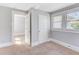 Cozy bedroom with neutral carpet, two windows, and ample closet space at 232 Westminster Ne Dr, Atlanta, GA 30309