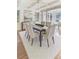 Bright dining room featuring hardwood floors, coffered ceilings, and modern lighting at 232 Westminster Ne Dr, Atlanta, GA 30309