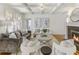 Elegant living room featuring a fireplace, coffered ceiling, and neutral color palette. A cozy space for gatherings at 232 Westminster Ne Dr, Atlanta, GA 30309