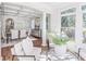 Bright, airy living room flows into the formal dining room with coffered ceilings and large windows at 232 Westminster Ne Dr, Atlanta, GA 30309