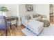 Inviting living room featuring a sectional sofa, rattan table, and wood floors at 232 Westminster Ne Dr, Atlanta, GA 30309