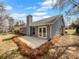 View of the backyard featuring a patio and manicured landscaping, perfect for outdoor relaxation at 2412 Cheyenne Ln, Lawrenceville, GA 30044