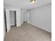 Neutral bedroom with carpet, closet, and natural light from an exterior window at 2412 Cheyenne Ln, Lawrenceville, GA 30044