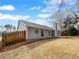 Side view of house featuring new siding and well maintained yard at 2412 Cheyenne Ln, Lawrenceville, GA 30044