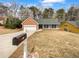 Charming home with a two-car garage and well-maintained lawn at 2412 Cheyenne Ln, Lawrenceville, GA 30044