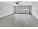 View of a garage with a roll-up door, offering ample space at 2412 Cheyenne Ln, Lawrenceville, GA 30044